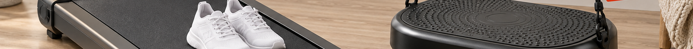 Under-desk walking pad next to a vibration plate with a red half-price tag