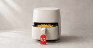 Air fryer with basket pulled out showing golden fries, red half-price tag on the handle — open-box air fryer deals in Canada