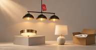 Black pendant, brass flush-mount and table lamp staged together with a red half-price tag