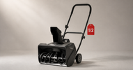 Compact electric snow blower with light snow on the auger and a red half-price tag — open-box snow blower deals in Canada