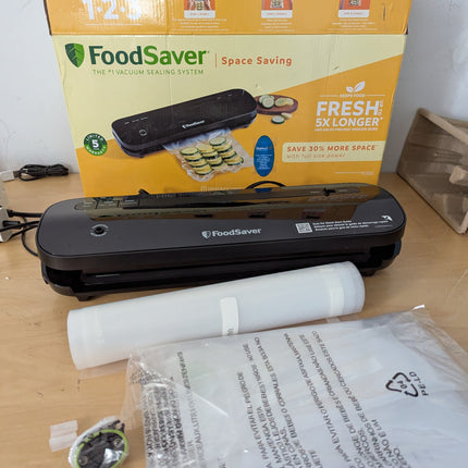 FoodSaver VS1210 Space Saving Vacuum Sealer with 1 Roll and 4 Bags