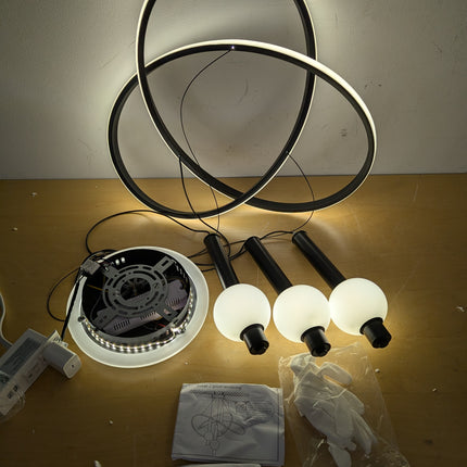 Actual unit: Becailyer LED chandelier rings lit, with globes, canopy, gloves and manuals
