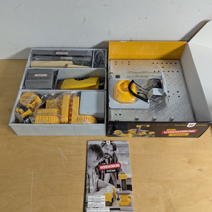 Actual unit: box contents with tools, wood pieces and guide
