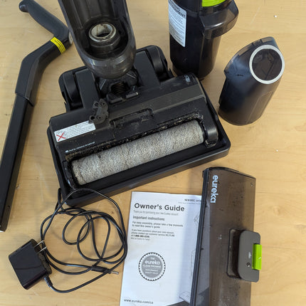 Actual unit: roller, tanks, handle and charging adapter laid out