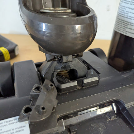 Actual unit fault: close-up of the broken catch at the base