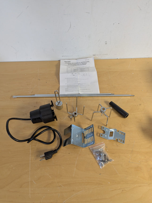 Actual unit: GrillSpot rotisserie kit with motor, spit rod, forks and brackets