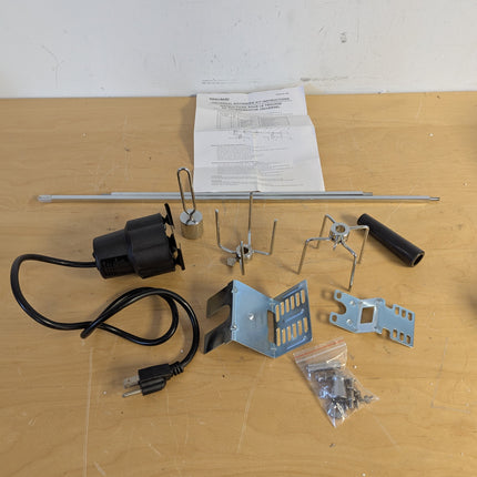 Actual unit: GrillSpot rotisserie kit with motor, spit rod, forks and brackets