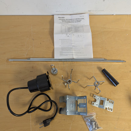 Actual unit: GrillSpot rotisserie kit with motor, spit rod, forks and brackets