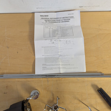 Actual unit: GrillSpot rotisserie kit with motor, spit rod, forks and brackets