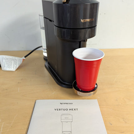 Actual unit: Nespresso Vertuo Next by De'Longhi, black with rose gold
