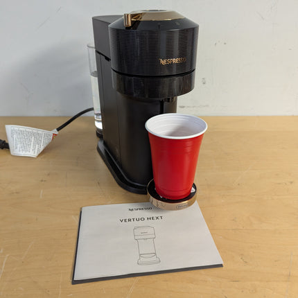 Actual unit: Nespresso Vertuo Next by De'Longhi, black with rose gold