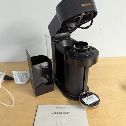 Actual unit: Vertuo Next with lid open and capsule container removed