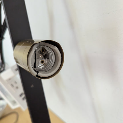 Actual unit: marks on a brass-tone socket cover
