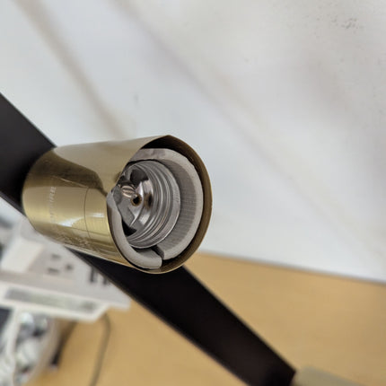 Actual unit: marks on a brass-tone socket cover